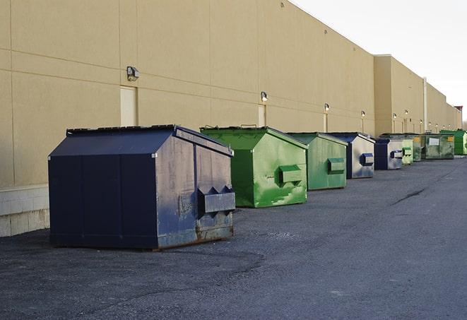 a pack of different construction bins lined up for service in Bayboro